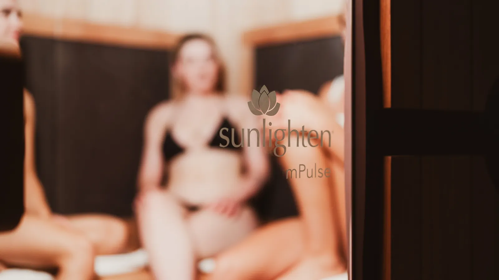 Woman relaxing inside the Sunlighten infrared sauna at Davaar House