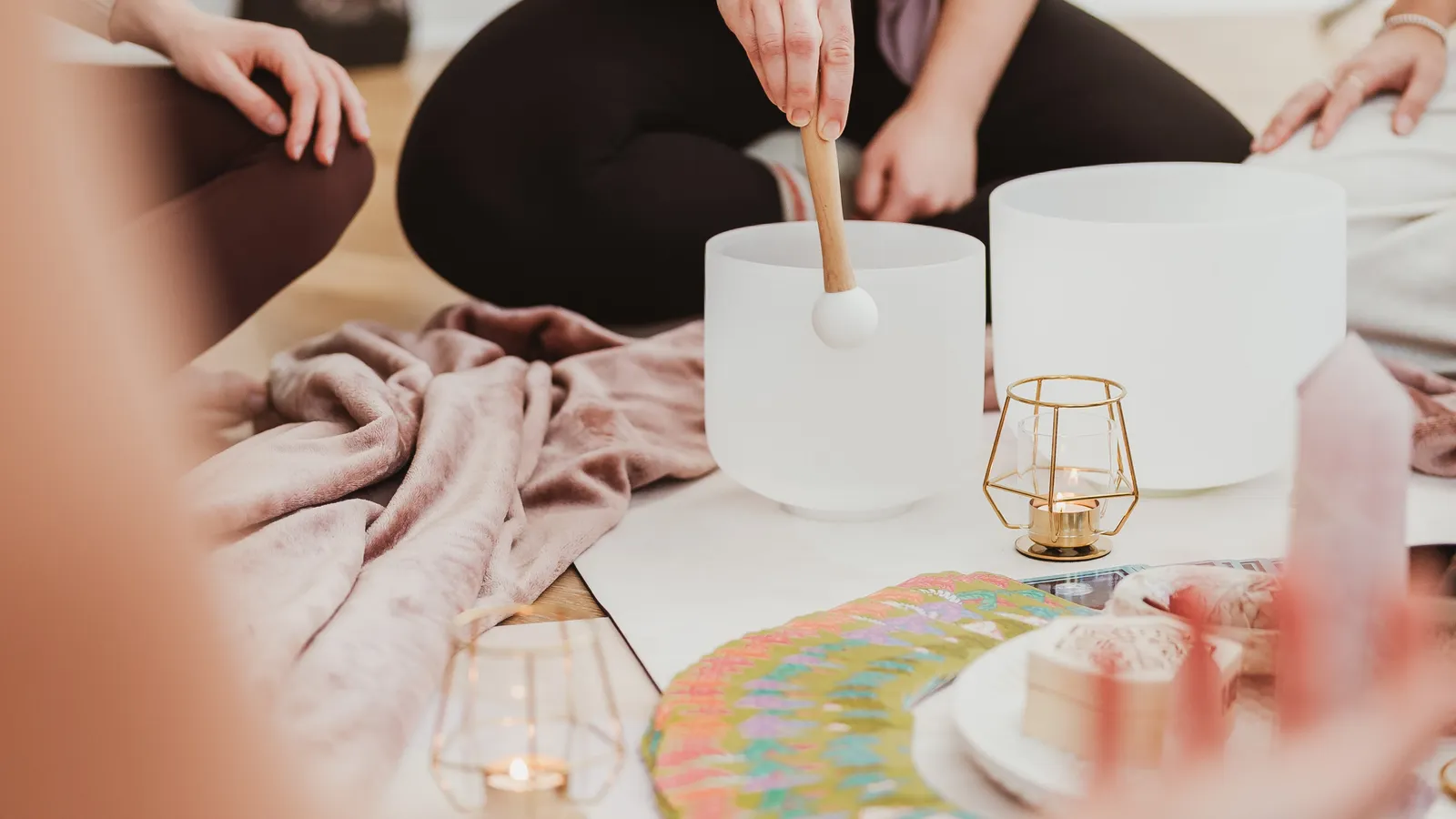 Sound healing practitioner with crystal singing bowls at Davaar House
