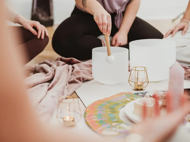 Sound healing practitioner with crystal singing bowls at Davaar House